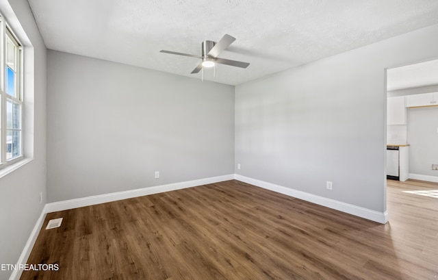 165 Kenzie Ln, Lafollette, TN 37766 - spare room featuring wood finished floors, a ceiling fan, and a textured ceiling