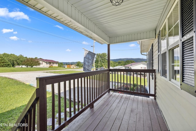 165 Kenzie Ln, Lafollette, TN 37766 - wooden porch with a lawn and a residential view