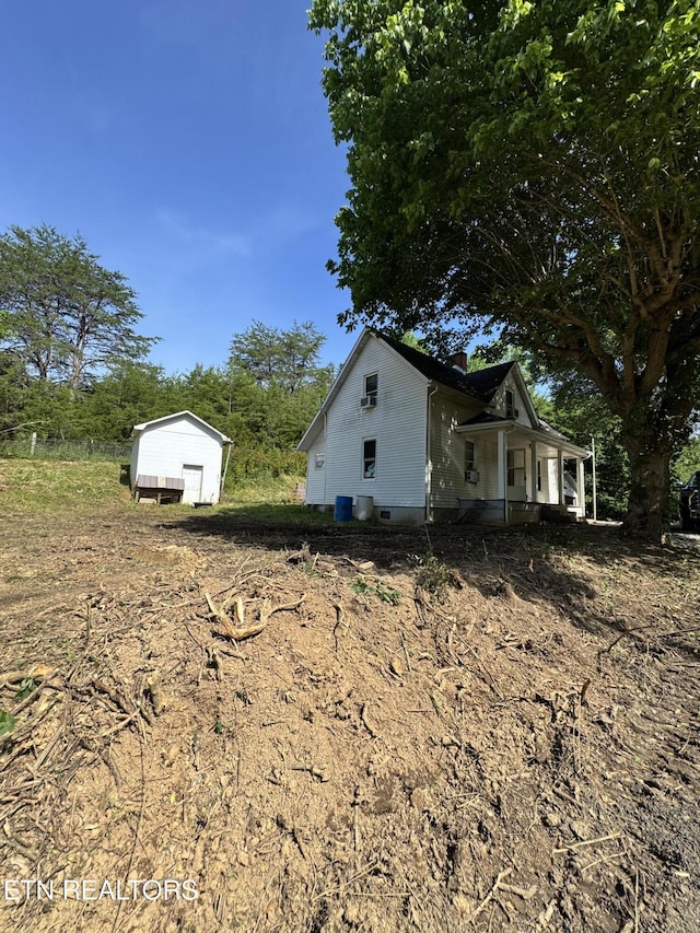 2395 Howard Rd, Bybee, TN 37713 - view of home's exterior featuring a porch and a chimney