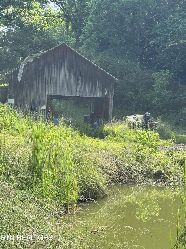 2395 Howard Rd, Bybee, TN 37713 - view of outdoor structure with a forest view