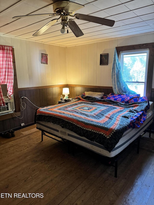2395 Howard Rd, Bybee, TN 37713 - bedroom featuring hardwood / wood-style flooring, wood walls, and ceiling fan