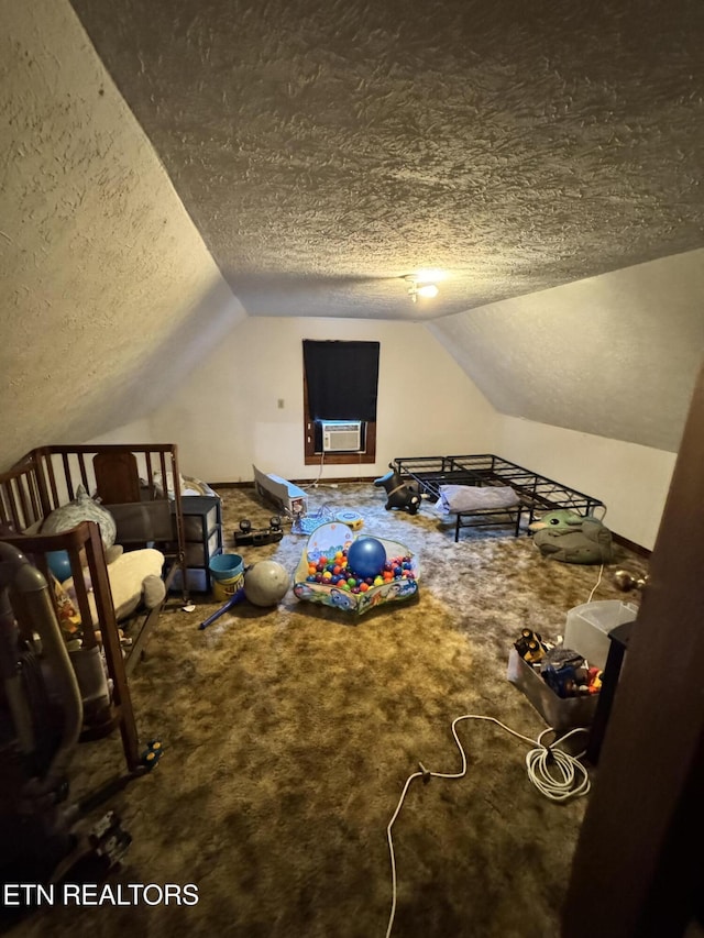 2395 Howard Rd, Bybee, TN 37713 - additional living space with a textured ceiling, vaulted ceiling, carpet flooring, and cooling unit