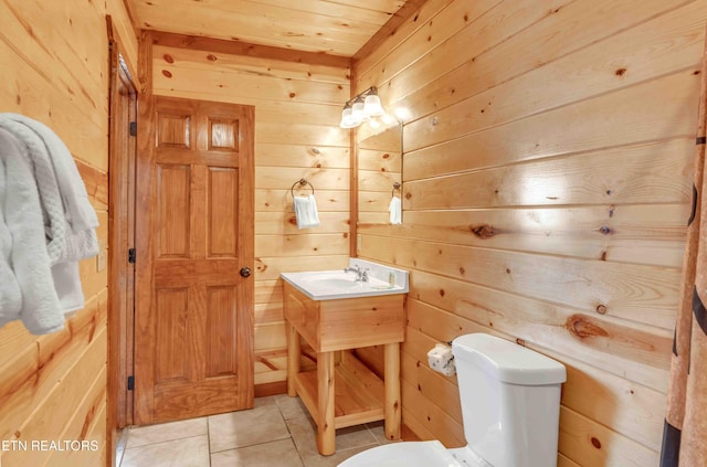 3708 Tilda Hilltop Way, Sevierville, TN 37862 - half bath with wood walls, vanity, toilet, and tile patterned floors