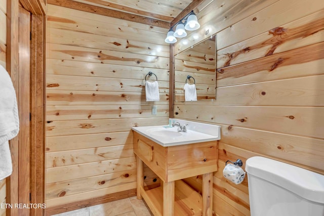 3708 Tilda Hilltop Way, Sevierville, TN 37862 - bathroom with wooden walls, vanity, toilet, and tile patterned flooring