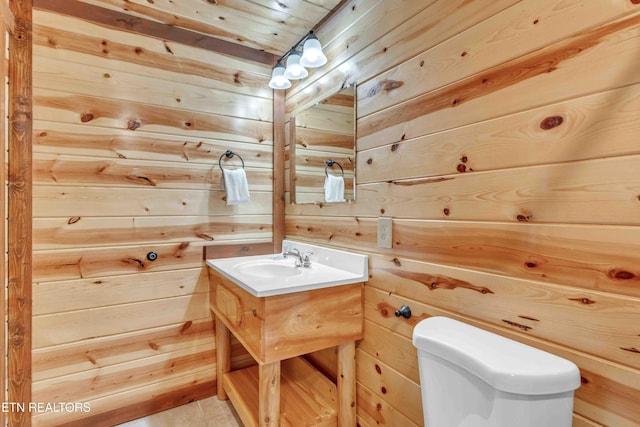 3708 Tilda Hilltop Way, Sevierville, TN 37862 - half bathroom featuring wooden walls, vanity, and toilet