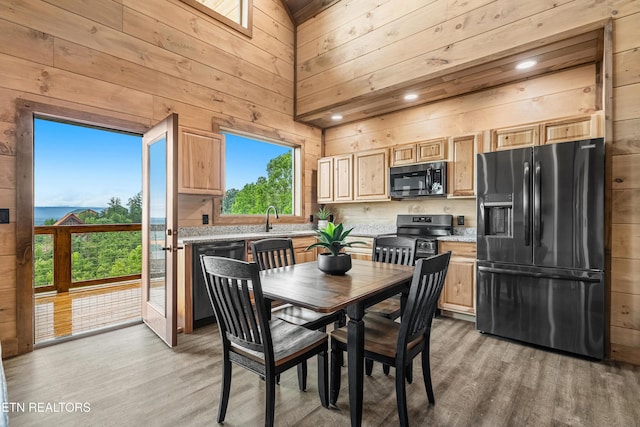 2251 Fox Berry Way, Sevierville, TN 37876 - dining space featuring wood walls and light wood finished floors