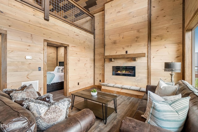 2251 Fox Berry Way, Sevierville, TN 37876 - living room with wooden walls, wood finished floors, and a glass covered fireplace