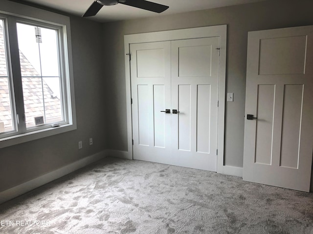 85 Royal Troon Cir, Oak Ridge, TN 37830 - unfurnished bedroom with multiple windows, carpet, a closet, and a ceiling fan