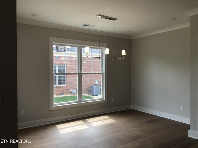 85 Royal Troon Cir, Oak Ridge, TN 37830 - unfurnished dining area with dark wood finished floors, crown molding, and a chandelier