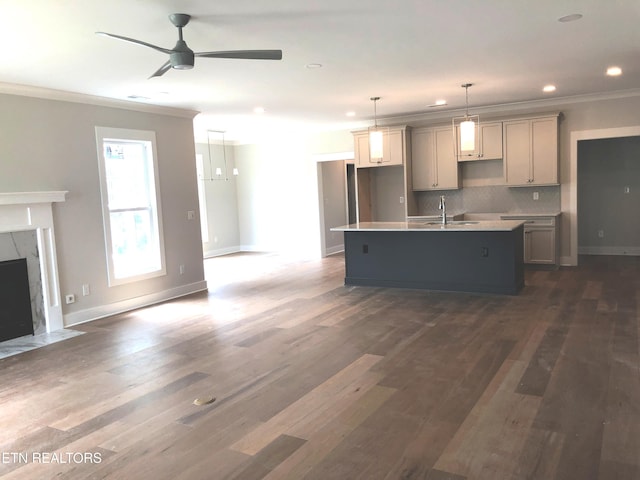 85 Royal Troon Cir, Oak Ridge, TN 37830 - kitchen featuring a center island with sink, crown molding, gray cabinetry, a ceiling fan, and dark wood finished floors