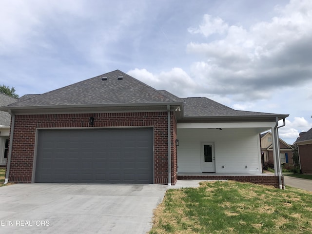 85 Royal Troon Cir, Oak Ridge, TN 37830 - single story home featuring roof with shingles, brick siding, driveway, and an attached garage