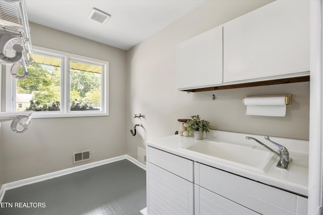 386 E Dr, Oak Ridge, TN 37830 - washroom featuring cabinet space and baseboards