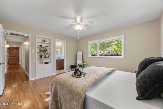 386 E Dr, Oak Ridge, TN 37830 - bedroom with light wood finished floors, ensuite bath, and a ceiling fan