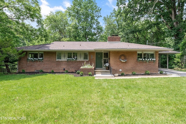 386 E Dr, Oak Ridge, TN 37830 - view of front of property with brick siding, a front lawn, and a chimney