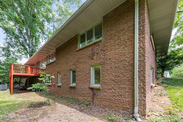 386 E Dr, Oak Ridge, TN 37830 - view of home's exterior featuring a wooden deck and brick siding