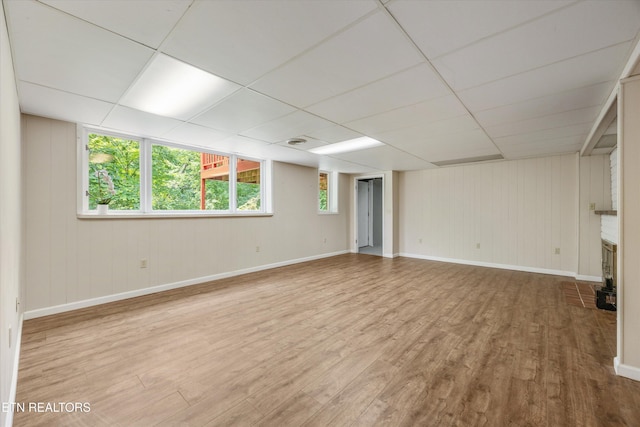 386 E Dr, Oak Ridge, TN 37830 - below grade area with wood finished floors, a drop ceiling, and wood walls
