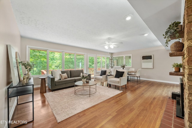 386 E Dr, Oak Ridge, TN 37830 - living area with ceiling fan, healthy amount of natural light, wood finished floors, a textured ceiling, and recessed lighting