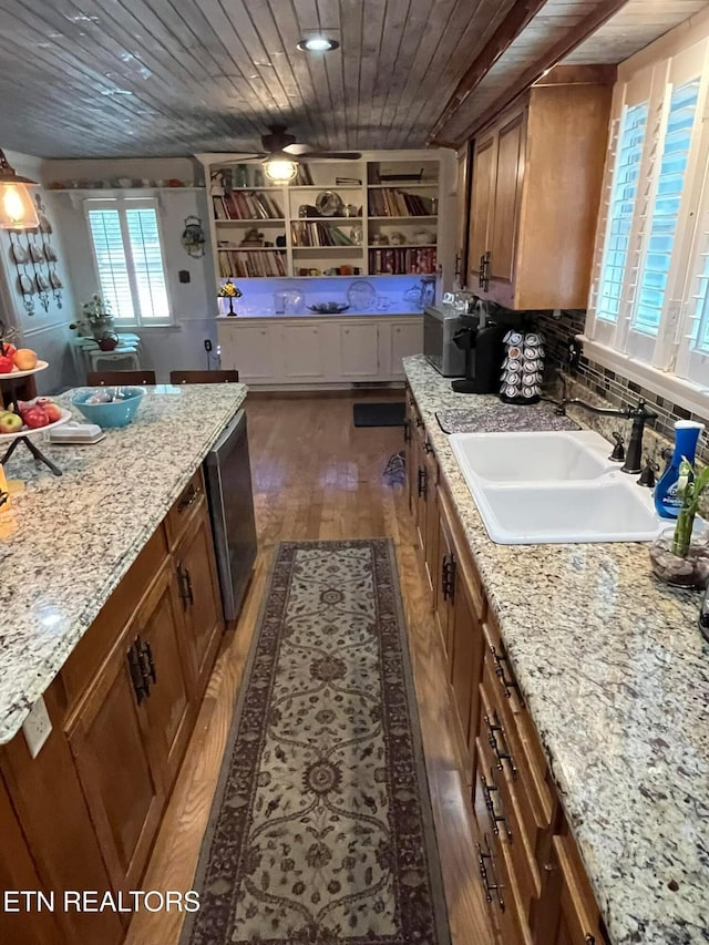 242 Adams Ln, Jellico, TN 37762 - kitchen with brown cabinets, dark wood-type flooring, wooden ceiling, stainless steel dishwasher, and light stone countertops