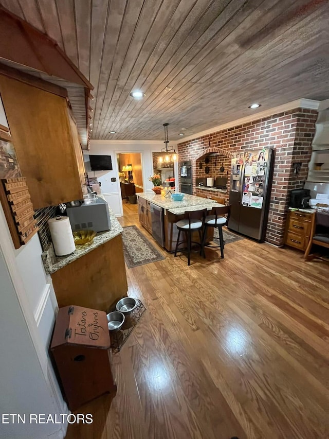 242 Adams Ln, Jellico, TN 37762 - kitchen with stainless steel appliances, wooden ceiling, light wood finished floors, brick wall, and light stone counters