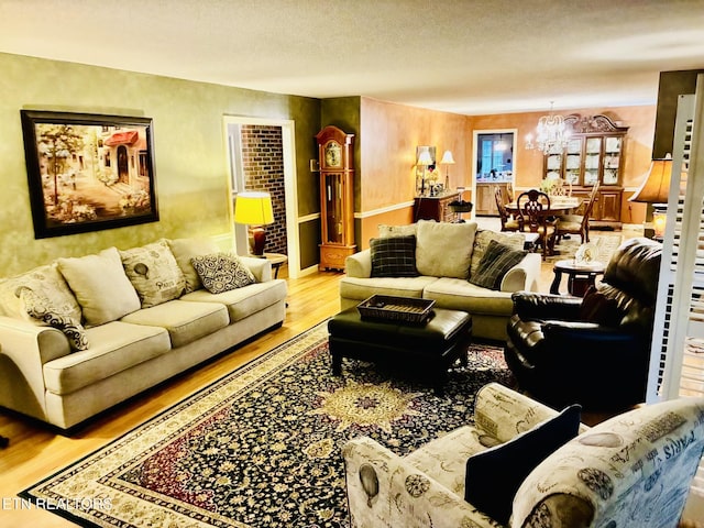 242 Adams Ln, Jellico, TN 37762 - living area with wood finished floors, a chandelier, and a textured ceiling