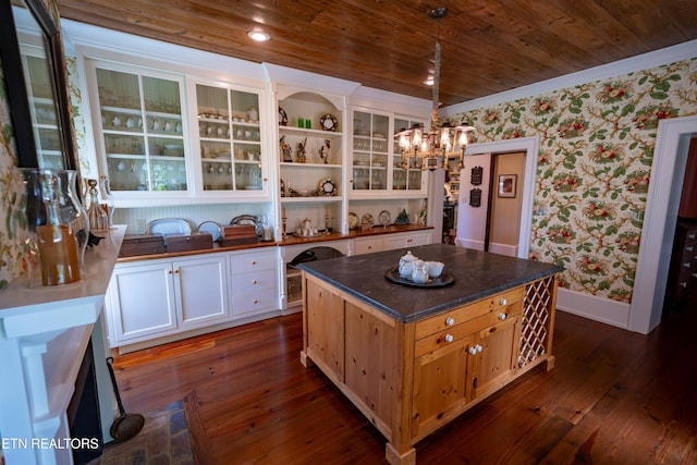 2590 Day Rd, Strawberry Plains, TN 37871 - kitchen featuring wallpapered walls, dark countertops, a chandelier, wood ceiling, and open shelves