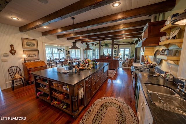 2590 Day Rd, Strawberry Plains, TN 37871 - kitchen with dark countertops, open shelves, dark wood finished floors, a large island, and a wood ceiling with exposed beams