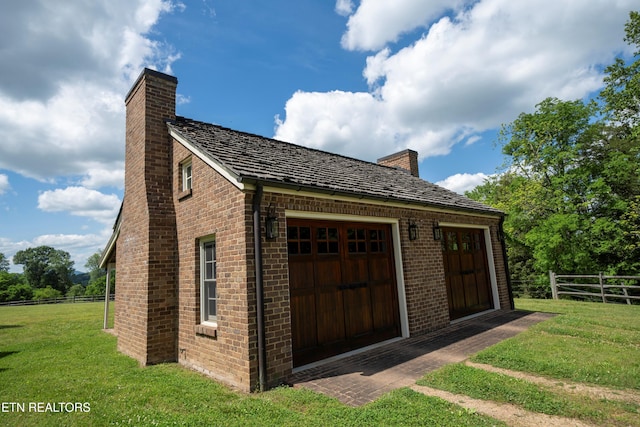2590 Day Rd, Strawberry Plains, TN 37871 - view of side of property featuring a chimney, brick siding, and an outbuilding