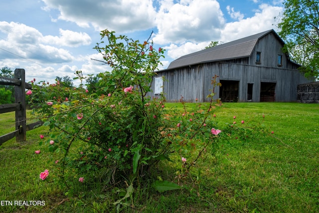 2590 Day Rd, Strawberry Plains, TN 37871 - view of yard featuring a barn, an outdoor structure, and a garage