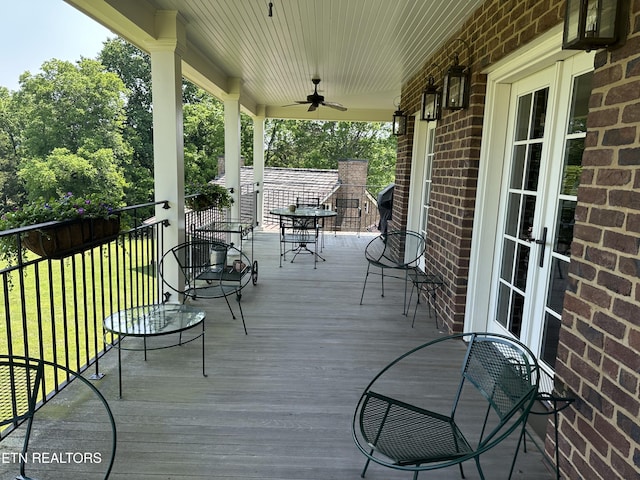 2590 Day Rd, Strawberry Plains, TN 37871 - wooden porch with a yard and ceiling fan