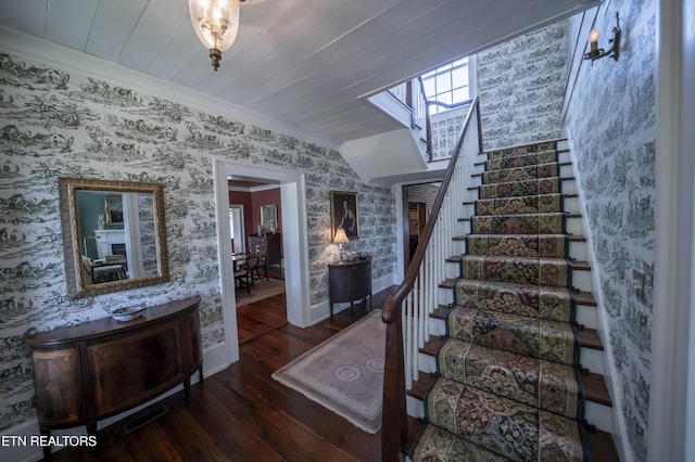 2590 Day Rd, Strawberry Plains, TN 37871 - stairs with wallpapered walls, a skylight, wood-type flooring, ornamental molding, and lofted ceiling