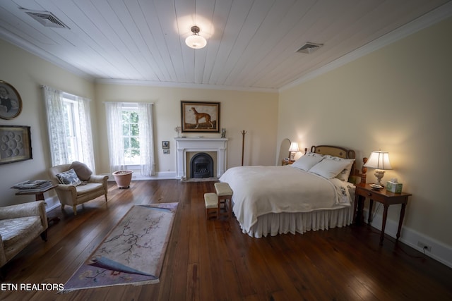 2590 Day Rd, Strawberry Plains, TN 37871 - bedroom with ornamental molding, hardwood / wood-style flooring, and a fireplace