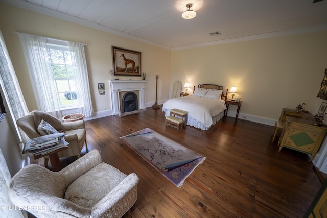 2590 Day Rd, Strawberry Plains, TN 37871 - bedroom with crown molding, wood finished floors, and a fireplace