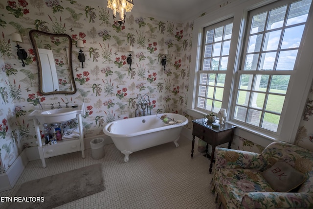 2590 Day Rd, Strawberry Plains, TN 37871 - bathroom featuring plenty of natural light, a freestanding bath, tile patterned floors, and wallpapered walls