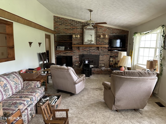 165 Bud Hatmaker Ln, Lafollette, TN 37766 - living room with vaulted ceiling, a textured ceiling, carpet flooring, a ceiling fan, and a brick fireplace