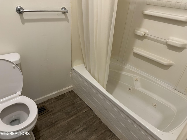 165 Bud Hatmaker Ln, Lafollette, TN 37766 - bathroom featuring a combined bath / shower with jetted tub and wood finished floors