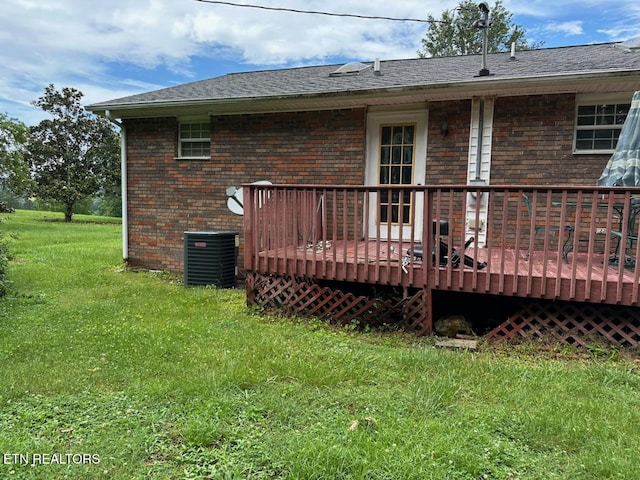 165 Bud Hatmaker Ln, Lafollette, TN 37766 - rear view of property featuring a yard, brick siding, and a wooden deck