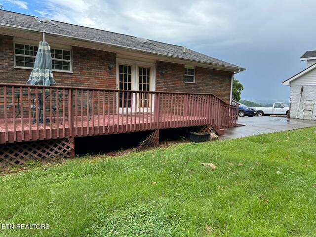 165 Bud Hatmaker Ln, Lafollette, TN 37766 - rear view of house featuring brick siding, a lawn, and a wooden deck