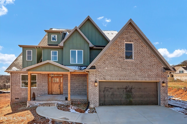 835 Anchor Vista Rd, Knoxville, TN 37934 - view of front of home with board and batten siding, brick siding, concrete driveway, and an attached garage