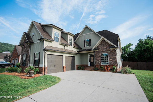 7481 Nightfall Cir, Ooltewah, TN 37363 - craftsman inspired home with concrete driveway, a garage, a shingled roof, and brick siding