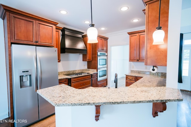 7481 Nightfall Cir, Ooltewah, TN 37363 - kitchen with appliances with stainless steel finishes, custom range hood, a peninsula, brown cabinetry, and recessed lighting