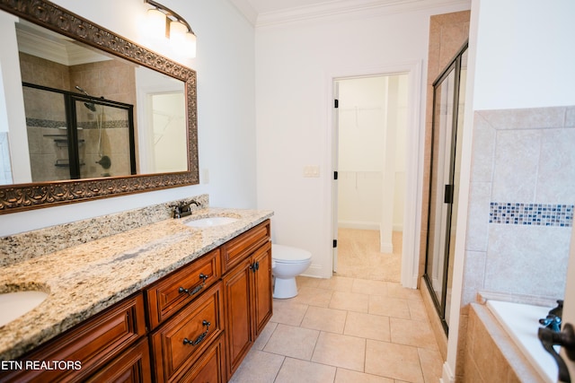 7481 Nightfall Cir, Ooltewah, TN 37363 - bathroom featuring a stall shower, double vanity, a spacious closet, a bath, and crown molding