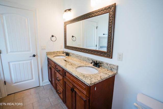 7481 Nightfall Cir, Ooltewah, TN 37363 - bathroom featuring double vanity and tile patterned flooring