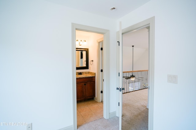 7481 Nightfall Cir, Ooltewah, TN 37363 - hallway featuring light carpet and baseboards