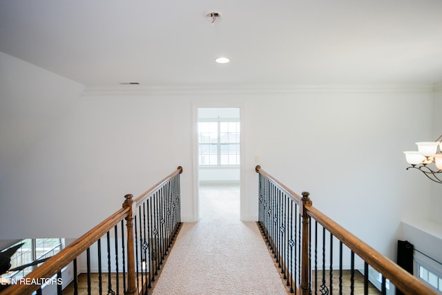 7481 Nightfall Cir, Ooltewah, TN 37363 - corridor featuring an upstairs landing, crown molding, carpet flooring, a chandelier, and recessed lighting