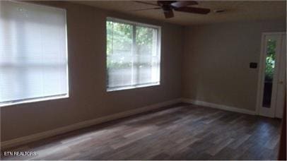 100 Nasson Ln, Oak Ridge, TN 37830 - unfurnished room featuring ceiling fan and dark wood-style flooring