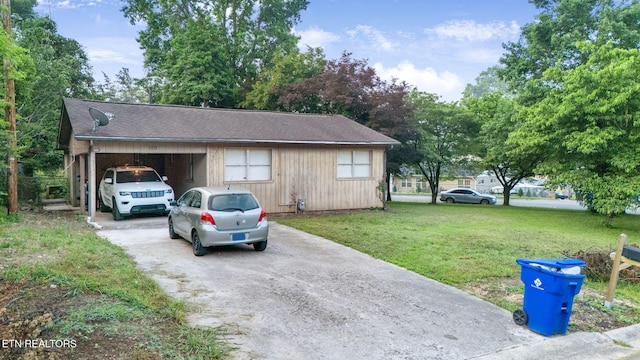 100 Nasson Ln, Oak Ridge, TN 37830 - view of property exterior featuring driveway, a yard, and a carport