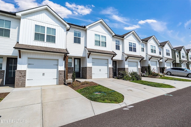 205 Harper Village Way, Lenoir City, TN 37771 - multi unit property with a residential view, board and batten siding, concrete driveway, and a garage