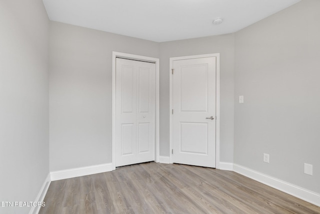 205 Harper Village Way, Lenoir City, TN 37771 - unfurnished bedroom with light wood finished floors and a closet