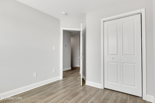 205 Harper Village Way, Lenoir City, TN 37771 - unfurnished bedroom featuring light wood-style floors and a closet
