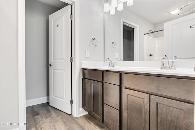 205 Harper Village Way, Lenoir City, TN 37771 - bathroom featuring double vanity, wood finished floors, and a shower